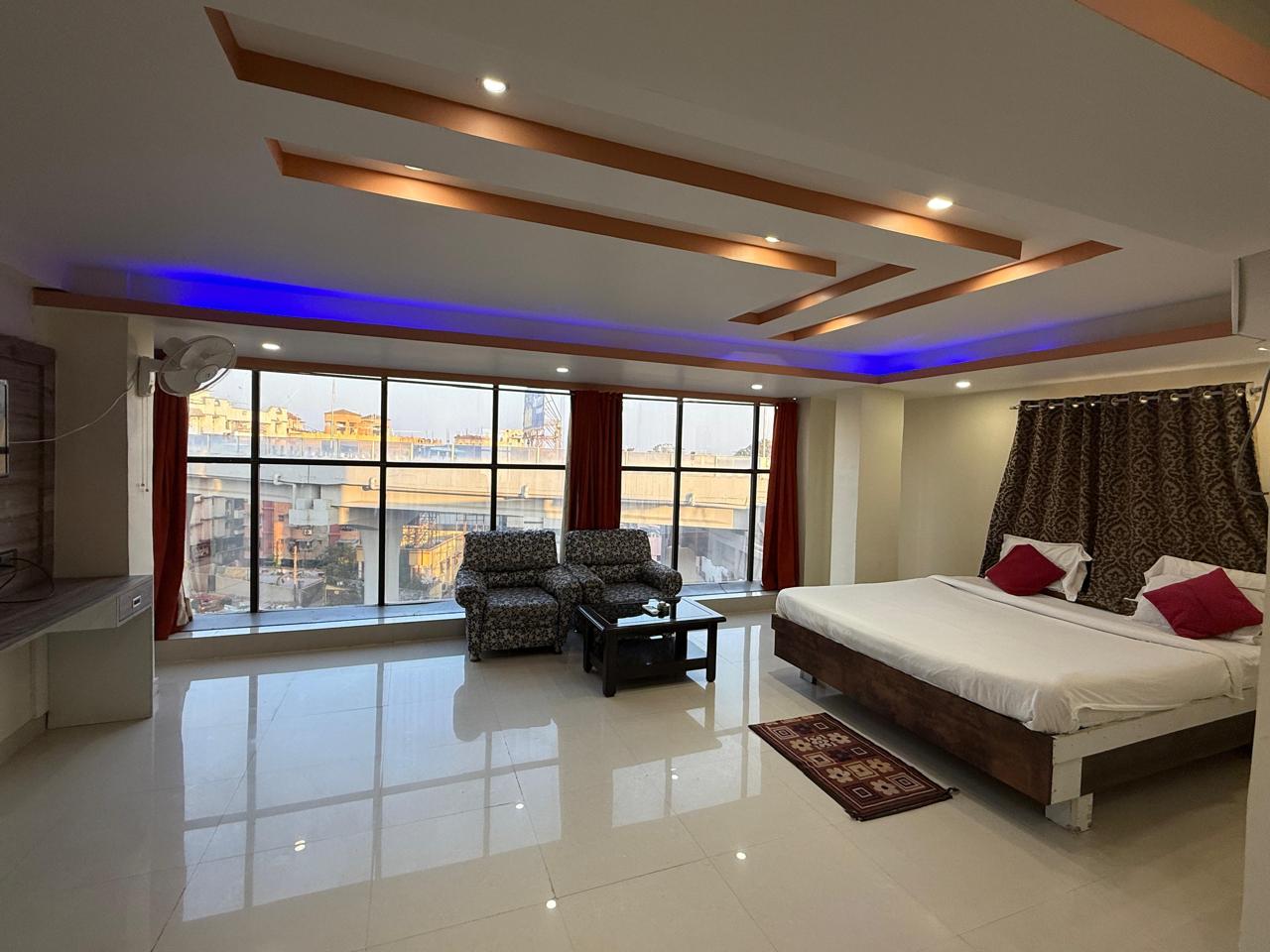 Spacious deluxe room with city view at Hotel Bodhraj Inn